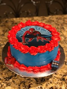 a spiderman cake on a counter top