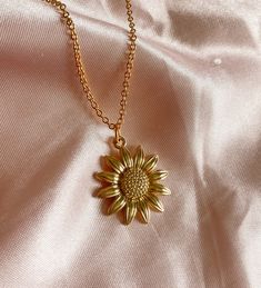 "Our favorite, this cute Sunflower charm Necklace in gold! 🌻 Hand made by Holly from Tumbled Shop with a gold tone pendant of a yellow sunflower and hung on a 14K gold plated chain 18\" long.  We are honored you are here! Thank you for supporting our small business and unique healing creations. Orders over $50 get free shipping in the US & a Free TumbledShop sticker! 🔮To stay updated with new items follow us on Instagram @Tumbledshop OR Click the link below! 🌻 https://www.instagram.com/tumbledshop/ ** Remember to FAVORITE the Tumbled Shop as I add inventory daily! (Click the heart next to our shop name). ❤️" 14k Gold-filled Birth Flower Jewelry, 14k Gold Filled Flower Necklace, 14k Gold-filled Flower Necklace, Yellow Flower Shaped Jewelry With Adjustable Chain, Dainty Gold Flower-shaped Jewelry, Everyday Flower Charm Necklaces, Gold Flower Pendant Necklace With Adjustable Chain, Gold Pendant Flower Necklace With Adjustable Chain, Gold Plated Flower Charm Pendant Necklace