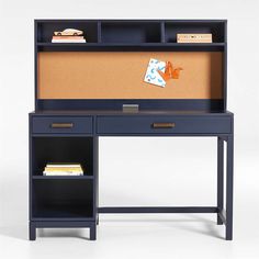 a blue desk with a corkboard on top