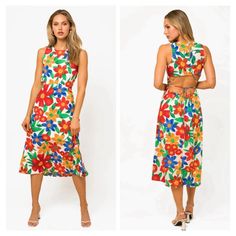 This Midi Dress Features A Vibrant Tropical Floral Print, Perfect For A Fun And Girly Look. The Crew Neckline And Sleeveless Design Provide Comfort, While The Elasticized Waist Creates A Flattering Fit. The Open Back With Button And Lace Down Closure Adds An Eye-Catching Detail. Lined For Coverage, This Non-Stretchy Dress Is Cute And Playful. Materials 100% Polyester Lining: 100% Polyester Made In Guatemala Medium: Length: 50", Bust: 28" True To Size Multicolor Floral Print Midi Beach Dress, Multicolor Floral Print Midi Dress For Beach, Casual White Dress With Vibrant Print, White Sleeveless Maxi Dress With Vibrant Print, Tropical Print Midi Dress For Vacation, White Floral Print Midi Dress For Vacation, Summer White Printed Midi Dress, Multicolor Tropical Print Midi Dress For Day Out, White Midi Dress With Vibrant Print For Vacation