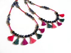 Dark bright shades of blue and pink, playful tassels and stars: this necklace is the perfect boho piece and a color accent to add to an outfit. Made with Lapis lazulli in geometric cut shapes, tiny handmade cotton tassels in pink, purple and petroleum green, raw brass stars and tubes and glass beads. ►Pick between different lengths, wear two necklaces for a statement layered look or a single strand as an accent. ►Length Options: 18/20/24/26/28 inches. Modeled necklaces are: Short necklace is 18 Adjustable Bohemian Tassel Necklace With Colorful Beads, Adjustable Tassel Necklace For Festivals, Adjustable Dangle Tassel Necklace For Festivals, Adjustable Long Tassel Necklace With Dangling Beads, Bohemian Tassel Necklace With Colorful Round Beads, Bohemian Tassel Necklace With Colorful Beads, Bohemian Adjustable Tassel Necklace With Fringe, Bohemian Tassel Necklace With Round Beads For Beach, Adjustable Bohemian Tassel Necklace