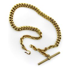 This is part of Chairish’s Fine Jewelry assortment.  This 14k gold watch chain has a fabulous hollow link interwoven with tiny balls for an unusual variation of a curb link. The links are carved with a ribbed texture that give a matte surface to the gold. This creates a unique visual texture that almost gives the illusion that the lines of the chain are blurry or out of focus. The tiny balls add a vertebrae-like element that reinforces the chain and make its movement serpentine.   At each end of Antique Curb Chain Necklace, Victorian Style Necklace With Curb Chain Link, Victorian Link Necklaces With Curb Chain, Antique Oval Link Gold Chain Jewelry, Victorian Style Curb Chain Link Necklace, Victorian Link Necklace Hallmarked, Victorian Hallmarked Link Necklace, Antique Gold Chain Link Jewelry, Victorian Curb Chain Necklaces