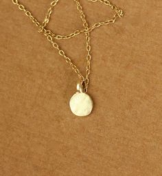 Tiny gold dot necklace - everyday necklace - dainty necklace - dot necklace - circle necklace - a tiny gold disc on a 14k gold vermeil chain This dainty and delicate 22k gold vermeil dot hangs from a 16 inch 14k gold vermeil chain.. Please feel free to select a different length if you prefer! Need an energy boost? Or a little pop of color? https://www.etsy.com/listing/165088081/add-a-gemstone-power-boost-healing-gem?ref=shop_home_active The Hand (Khamsa), particularly the open right hand, is a s Dot Necklace, Necklace Everyday, Gold Dot, Gold Disc, Energy Boost, Everyday Necklace, Gold Dots, Circle Necklace, Necklace Dainty