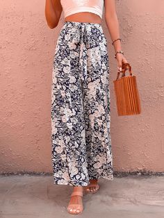 Unleash your inner fashionista with our Cancun Printed Wide Leg Belted Pant! Perfect for a day at the beach or a night out, these pants feature a fun print and a belted waist for a flattering fit. Say goodbye to boring pants and hello to style and comfort! Size Guide: Model is 5’6” tall, and has a 32.2” bust, 24.1”waist, & 35.6” hips. She is wearing a S / US 4 / AU 8. This pants is true to size. Material: 100% Rayon Feature: High rise. Belted Tie. Wide leg. Floral Printed. Back zipper closure. Relax Fit. Not lined. Care Instructions: Machine wash / Cold hand wash Floral Print Pants For Beach Day Out, Summer Floral Print Pants For Day Out, Printed Pants For Beach Vacation, Floral Print Pants For Vacation And Beach Season, High-waisted Floral Print Beach Pants, Floral Print Summer Bottoms For Brunch, High-waisted Floral Beach Pants, Beach High-waisted Floral Print Pants, Printed Summer Pants For A Day Out