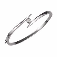 Our solitaire bangle bracelet is set with a fine-quality diamond that weighs 0.25ct. The hinged bracelet weighs 13 grams and is available in 14k white, yellow, and rose gold. Classic White Gold Bangle With Single Diamond, Classic Bangle With Single Diamond For Anniversary, Classic Single Diamond Bangle For Anniversary, Classic Anniversary Bangle With Single Diamond, Timeless Single Diamond Bangle For Anniversary, Timeless Anniversary Bangle With Single Diamond, Fine Jewelry Bangle With Single Diamond, Diamond Bangle With Single Diamond For Wedding, Classic Single Diamond Bangle For Wedding