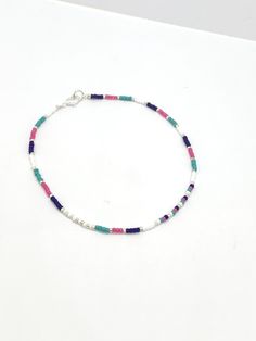 Turquoise, royal blue, pink and white seed bead anklet Dimensions Seed beads are 2mm glass Plated findings An extender is available Postage: UK: Items are sent 2nd class mail, but can be upgraded to 1st class mail for a small fee at checkout. International orders are sent by Standard Royal Mail - untracked. An upgrade is available at checkout. Thank you for visiting and please come back again. If you have any queries, please don't hesitate to contact me. Beaded anklet women, colourful bead ankle Dainty Colorful Beads Anklets As A Gift, Dainty Anklets With Colorful Beads As Gift, Dainty Colorful Beaded Anklets As Gift, Gift Anklets With Tiny Beads, Multicolor Beaded Chain Anklets As Gift, Blue Beaded Chain Anklets As Gift, Blue Beaded Chain Anklets For Gift, Blue Tiny Beads Anklet For Gift, Blue Anklet With Tiny Beads For Gift