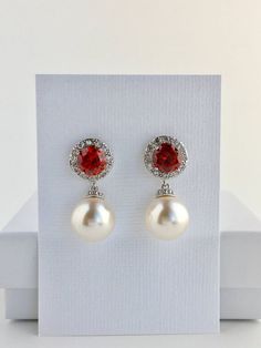 Red Bridal Earrings Red Crystal Halo Earrings Wedding Cubic Zirconia Earrings Bridal Red Swarovski P Elegant Red Pearl Earrings For Parties, Elegant Red Bridal Earrings, Red Pearl Earrings For Party, Red Dangle Pearl Earrings For Party, Red Clip-on Earrings For Formal Occasions, Ruby Dangle Bridal Earrings, Ruby Dangle Bridal Earrings As Gift, Ruby Dangle Bridal Earrings For Gifts, Red Dangle Crystal Earrings For Anniversary