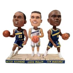 three bobble head basketball players on top of each other