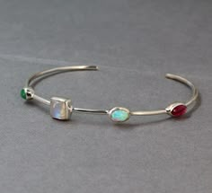 Lovely feminine Sleek 4 stone station Cuff Bracelet.Made of Solid 925 Sterling Silver is studded with genuine Emerald,Moonstone,Tourmaline and Ethiopian Opal .It is an Adjustable Bangle Bracelet,and available in small,medium and large sizes.This is a cute dainty cuff bracelet for your Wife/Girl Friend on your Anniversary.Lovely cuff for your daughter's Graduation.Good comfortable and light weight  for women of all ages.. Stone And Silver Ring, Cuff Bracelet With Stones, Silver Bracelets With Stones, Jewelry Gifts For Women, Silver Jewelry Inspiration, Dainty Silver Bracelets, Silver Opal Jewelry, Opal Cuff Bracelet, Silver Cuff Bracelets