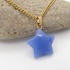 "Cornflower Blue Glass Star Pendant Necklace, Men's Necklace, Celestial Star Jewelry, Women's Necklace, Men's Jewelry, Celestial Fashion Jewelry Materials: Glass Star Pendant, Clear Color Dimensions: 13/16 wide x 7/8\" tall STAINLESS STEEL CHAINS - Hypo Allergenic, Resist Tarnishing SMALL GOLD STAINLESS STEEL CHAINS Sm Flat Link Chain, 3 x 2 x 0.6mm, Yellow Gold Stainless Steel Chain, Lobster Clasp Sm Twist Curb Chain, 3 x 2 x0.6mm, Yellow Gold Stainless Steel Chain, Lobster Clasp CORDED NECKLACES Black Waxen Cotton Cord: Waxen Cotton Cord 1.5mm with lobster clasp closure.  Brown Waxen Cotton Cord: Waxen Cotton Cord 1.5mm with lobster clasp closure.  Custom chain or cord length is available. Message me with your desired length. VISIT MY SHOP AT: https://www.etsy.com/shop/JDsFashionJewelry Blue Star Shaped Necklace For Gift, Blue Necklace With Star Charm As A Gift, Blue Star Charm Necklace As Gift, Blue Star Charm Necklace For Gift, Blue Star Charm Necklace As A Gift, Blue Star Of David Necklace As Gift, Blue Star Of David Necklace For Gift, Blue Star Of David Necklace Gift, Celestial Fashion