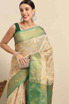 Product Features: Saree: Saree as seen in picture - Choose the drape style while order: Standard, Pleated or Gujarati Saree Color: Green Saree Fabric: Banarasi Art Silk Saree Style: Banarasi Saree Work: Floral Saree Pattern: Regal Weave Saree Print: floral zari woven Blouse: Blouse design must be chosen while ordering. For the blouse in pic, please choose the selection "As seen in picture" or customize your selection. Blouse Color: Green Blouse Fabric: Banarasi Art Silk Blouse Print or Pattern: Designer Tussar Silk Pre-draped Saree, Tissue Silk Dupatta For Navratri, Elegant Choli For Puja, Anarkali Pre-draped Tussar Silk Saree, Pista Green Cutdana Dupatta, Tissue Silk Pre-draped Saree For Navratri, Pre-draped Saree For Puja Festivals, Transitional Katan Silk Pre-draped Saree, Diwali Pre-draped Tussar Silk Saree