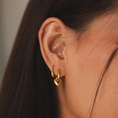 Slip into style with our Sleek Huggies earrings. These hoops are perfect for adding a touch of effortless sophistication to any outfit. Comfortable and chic, they are a must-have addition this spring. Material: Gold Vermeil Dimensions: 13.2mm x 14mm SKU: SAE-0200 Huggie Charm Earrings, Gold Hoop Earrings With Charms, Unique Gold Earrings, Double Lobe Piercing, Hoop Earrings With Charm, Quirky Accessories, Outfit Comfortable, Double Piercing, Earrings Double