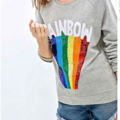 California Rainbow Slim Fit Crew Sweatshirt Create A Cool Look With This California Rainbow Slim Fit Crew Sweatshirt. In A Gray Hue, You'll Love The Rainbow Print On The Front. Featuring Long Sleeves, A Crew Neck And An Elasticated Hemline, You'll Love Grabbing This On The Way Out Before A Busy Day. Features: Slim Fit Ladies Sweat Shirt. Fit: Take Normal Size. Collar: Crew Neck Color: Distressed Grey Long Sleeve Rainbow Pattern Applique On Front. Women's Pullover Sweatshirt, Jumper. Material Rainbow Clothes, Sequined Sweatshirt, Rainbow Outfit, Sweatshirt For Women, Rainbow Print, Cool Look, Pullover Designs, Women Hoodies Sweatshirts, Crew Sweatshirts