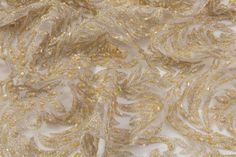 Champagne gold beads and embroidery on a champagne gold tulle. Elegant Intricate Embroidery Fabric For Evening, Elegant Beaded Lace Embroidered Fabric, Elegant Beige Embroidered Fabric For Festive Occasions, Elegant Pearl Embroidered Fabric For Reception, Elegant Silver Embroidered Organza Fabric, Elegant Embroidered Fabric With Pearl Embroidery For Reception, Festive Cream Embroidered Fabric For Formal Occasions, Cream Embroidered Fabric For Festive Formal Occasions, Elegant Beaded Sequin Fabric For Wedding