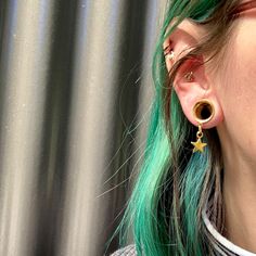 "WELCOME TO PINK ALIEN BABE YOUR ONE STOP SHOP FOR ALL THE CUTEST PLUGS AND ACCESSORIES IN THE GALAXY 🪐⭐️ 🎀This is a listing for A PAIR (two pieces) of Golden Star Light dangle earring internally threaded gauges in your choice of size 👽💕 Sizes available: 2g 6mm, 0g 8mm, 00g 10mm, 1/2\" 12mm, 9/16\" 14mm, 5/8\" 16mm (Message us for information about larger sizes!) 👽💕 Looking for more dangle styles? https://www.etsy.com/shop/pinkalienbabe/?etsrc=sdt&section_id=29688744 🌈💖 Your new plugs wi Gold Nickel-free Star Cartilage Earrings, Gold Star Cartilage Earrings Nickel Free, Gold Star Cartilage Earrings For Pierced Ears, Gold Star Shaped Pierced Cartilage Earrings, Gold Star Cartilage Earrings, Pink Alien, Dangle Gauges, Ear Tunnels, Ear Weights