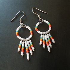 "Bright colors for a carefree summertime vibe! All the metal is stainless steel, so they will never tarnish and they are also hypoallergenic. These dangle 1 3/8\" (35mm) and are approximately 3/4\" Wide (17mm)." White Coral, Coral Orange, Orange And Turquoise, Seed Bead Earrings, Summer Colors, Bright Colors, Beaded Earrings, Seed Beads, Bead Work