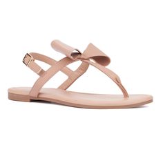 From the beach to the boardwalk, the Abril sandal is a quintessential summer essential. Its minimalistic design, adorned with a charming bow detail, adds a touch of femininity to any outfit. Perfect for warm weather, this versatile sandal effortlessly enhances your summer style, making it a must-have for your seasonal wardrobe. Casual Summer Flip Flops With Bow, Summer Bow Flip Flops With Open Toe, Chic Adjustable Flip Flops For Summer, Summer Beach Flip Flops With Bow, Summer Bow Sandals For Beach, Adjustable Bow Sandals For Beach, Adjustable Strap Jelly Sandals For Summer, Summer Sandals With Bow And Adjustable Straps, Chic Adjustable Jelly Sandals For Summer