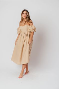 The Hamilton is everything you're looking for in a midi dress - charming, sophisticated, and absolutely flattering. It features premium quality details, like a sweetheart neckline and gorgeous balloon sleeves that can be worn on or off the shoulder. It's an unforgettable choice for every body type, and extra-comfy for expecting mamas! The best part? You can wear this beauty long after your sweet baby arrives! Available in multiple colorways. FIT: Runs true to size. Features a smocked back panel for comfort. This dress is roomy in the waist and will accommodate early maternity in your true size, but consider sizing up if you are in advanced pregnancy. MATERIAL: GARMENT DETAILS: Empire-waisted midi dress, with sweetheart neckline and statement balloon sleeves that can be worn on or off the s Elegant Off-shoulder Dress With Ruched Bodice For Spring, Chic Dress With Gathered Neckline For Brunch, Chic Brunch Dress With Gathered Neckline, Elegant Midi Dress With Smocked Bodice For Daywear, Midi Dress With Ruched And Fitted Bodice For Brunch, Puff Sleeve Midi Dress With Smocked Bodice, Chic Knee-length Puff Sleeve Dress For Day Out, Chic Knee-length Flowy Puff Sleeve Dress, Chic Brunch Midi Dress With Ruched Bodice