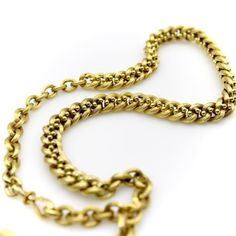 This is part of Chairish’s Fine Jewelry assortment.  This 14k gold watch chain has a fabulous hollow link interwoven with tiny balls for an unusual variation of a curb link. The links are carved with a ribbed texture that give a matte surface to the gold. This creates a unique visual texture that almost gives the illusion that the lines of the chain are blurry or out of focus. The tiny balls add a vertebrae-like element that reinforces the chain and make its movement serpentine.   At each end of Antique Oval Link Gold Chain Jewelry, Victorian Style Necklace With Curb Chain Link, Victorian Link Necklaces With Curb Chain, Antique Curb Chain Necklace, Victorian Style Curb Chain Link Necklace, Antique Gold Chain Link Jewelry, Antique Style Oval Link Chain Necklace, Victorian Gold Chain Link Jewelry, Victorian Jewelry With Oval Link Gold Chain