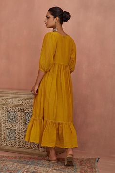 Yellow tunic featuring multi-colored floral and thread hand embroidery on the yoke. Comes with a matching slip for added comfort., Fit: Relaxed Western Dresses For Women, Embroidered Tunic, Tunic Length, Western Dresses, Puffed Sleeves, Flower Embroidery, Womens Tunics, Buy Dress, Trendy Colors