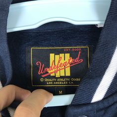 "PLEASE CONTACT TO ME WITH ANY QUESTION BEFORE BUYING.. PLEASE READ THE DESCRIPTION AND POLICIES BEFORE BUYING. TAG BRAND :-Undefeated SIZE ON TAG : Medium ACTUAL SIZE MEASUREMENT :- ARM PIT TO ARM PIT :-22.5\"incher BACK COLLAR TO HEM:-26\"incher PLEASE COMPARE THE MEASUREMENT WITH YOUR GARMENT CONDITION :8/10..(refer picture) COLOUR :-View Pic.. MATERIAL:-Cotton Kindly read my shipping and policies. SHIP WORLDWIDE VIA DHL GLOBAL MAIL. ⚫️Takes 14 working days to arrive. ⚫️Safely trackin number= Winter Baseball Collar Sweatshirt For Streetwear, Sporty Varsity Jacket With Letter Patch, Sporty Long Sleeve Varsity Jacket With Letter Patch, Casual Streetwear Sweatshirt With Baseball Collar, Casual Blue Outerwear With Logo Print, Collegiate Cotton Outerwear With Letter Patch, Sporty Cotton Varsity Jacket With Embroidered Logo, Casual Varsity Jacket With Letter Patch For College, Casual College Varsity Jacket With Letter Patch