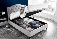 a bed that is open and sitting on the floor