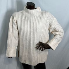 Old Navy Mock Neck Ribbed Knit Sweater. Ladies Small Petite - Ivory Pearl Color. Acrylic, Polyester, Nylon, Wool Blend. Very Soft. Cuffed Sleeves. Side Slits At Hem. Beige Ribbed High Neck Sweater, Beige Ribbed High-neck Sweater, Beige Ribbed Turtleneck Sweater, Cream Stretch Sweater, Fitted Off White Casual Sweater, Fitted Off-white Casual Sweater, Off White Textured Knit Long Sleeve Sweater, Off White Long Sleeve Textured Knit Sweater, Cream Ribbed Stretch Knit Top