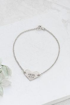 Beautiful bracelet with a dainty heart, hanging on a delicate disc chain, on which a letter, name, word, or number in English. The engraving is made by laser and is delicate and precise. You can choose to engrave one, two or three words. The price will vary according to the number of words engraved. Please write the text you wish to engrave in the comment box. The jewelry is made of high-quality 14k yellow or white gold, according to your choice. Please note that since this item is custom made a Silver Engraved Heart Name Bracelet, Heart-shaped Engraved Charm Bracelet, Personalized Sterling Silver Heart Bracelet, Heart Pendant Bracelet For Wedding And Mother's Day, Silver Heart Name Bracelet, Heart-shaped Engraved Name Bracelet For Mother's Day, Heart-shaped Engraved Bracelets For Mother's Day, Engraved Heart-shaped Name Bracelet For Mother's Day, Engraved Heart Name Bracelet For Mother's Day