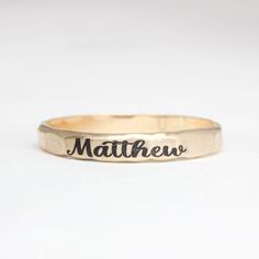 Simple name stacking rings with a satin finish. Made with .925 sterling silver, 14K gold filled, or 14K rose gold filled. Rings are approximately 2.5mm wide. Listing is for one ring Please message me if you would like a different font. These rings are made of high quality materials. The colors will not chip off or fade and can be worn in water. This ring is made to order in your size. If you don't see your size available please feel free to message me. All orders ship in a gift box. If you are o Adjustable 14k Gold Engraved Ring, Adjustable 14k Gold Jewelry With Engraving Option, Heirloom Style Personalized Everyday Rings, 14k Yellow Gold Engraved Ring With Hand Stamped Details, 14k Yellow Gold Hand Stamped Engraved Ring, Customizable Minimalist 14k Gold Engraved Ring, Everyday Engraving Ring Jewelry, Hand Stamped 14k Yellow Gold Engraved Ring, Stamped 14k Gold Wedding Jewelry