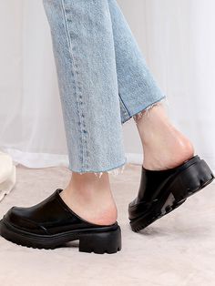 Editor's NotesSPUR's shoes are unique and timeless for everyday wear.- Platform Mules- Chunky lug sole- Modern trendy round front toe - Glossy leather texture- Feminine and minimal style- Easy slip-onMeasurements(in.)- Size: KR 230MM (US 6) ~ KR 250MM (US 8)- Heel Height: 2in.Composition & Care- Synthetic leather - Avoid direct heat and moisture- Professional cleaning is recommendedDesigner- by SPUR Casual Heels With Leather Sole And Round Toe, Casual Round Toe Heels With Leather Sole, Synthetic Round Toe Heels With Lug Sole, Synthetic Heels With Lug Sole And Round Toe, Trendy Clogs With Lug Sole And Round Toe, Casual Heels With Textured Sole And Round Toe, Casual Round Toe Heels With Rubber Cap, Casual Heels With Rubber Heel Cap And Round Toe, Casual High Heels With Lug Sole