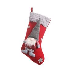 a red christmas stocking with an elf's head hanging from the side on a white background