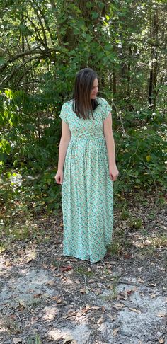 This beautiful mint floral maternity/nursing dress is the perfect dress to make you feel happy and bright this spring. It features a classic gathered skirt, making it maternity friendly. It is a classic dress that goes with every season. It's made of the softest brushed polyester to keep you comfortable while still remaining stylish. You will have easy breastfeeding access by simply lifting up the top layer. A second panel is underneath to keep it discreet as well.  Features: *Beautiful mint flo Flowy Modest Maternity Maxi Dress, Modest Maternity Dress For Spring, Modest Maternity Maxi Dress For Spring, Green Short Sleeve Maternity Dress For Summer, Fitted Green Maternity Dress With Short Sleeves, Green Short Sleeve Maternity Dress, Casual Green Maternity Dress, Modest Green Flowy Maxi Dress, Green Maternity Maxi Dress