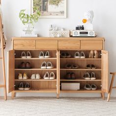 a wooden cabinet with shoes on it