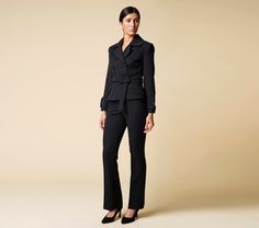 "Cut for a flattering slim-fit, this double breasted black blazer is crafted from a lightweight, luxurious viscose fabric. Complete with a cloverleaf lapel and finished with two-button cuffs - this blazer comes with the option of matching fitted pencil tuxedo pants, to form a womens suit. Jacket: - fitted silhouette - peplum style - cloverleaf lapel - double breasted closure - fabric buttons - matching fabric belt with buckle - fully lined Pants: - high rise - straight style - hook&loop + zi Chic Black Tailored Double Breasted Suit, Chic Tailored Double-breasted Pantsuit, Chic Business Casual Pantsuit With Double Button Closure, Chic Business Casual Pantsuit With Double Button, Fall Career Pantsuit, Double-breasted Tuxedo Style Pantsuit For Workwear, Chic Fitted Double Breasted Suit With Lapel Collar, Elegant Double Breasted Suit For Career In Fall, Double-breasted Fitted Pantsuit For Fall