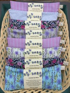 a wicker basket filled with lots of different types of fabrics on top of each other