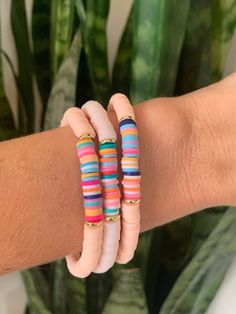 These lightweight Heishi bead bracelets are so fun for summer! They can be used for casual outfits or stacked up as a statement piece!  This listing is for ONE bracelet (your color choice) with gold accents and a rainbow center.  Each one is unique. Wear them alone or mix them up and make a stack! The possibilities are endless! The bracelets are 7", which fits average adult wrists.  I use a strong, stretchy cord for a nice, comfortable fit.  They are ready to ship for FREE! Happy shopping! Summer Heishi Beads Stretch Bracelet, Summer Stretch Bracelet With Tiny Beads, Bohemian Stretch Bracelet For Vacation, Multicolor Large Beads Stretch Bracelet For Beach, Casual Heishi Beads For Summer, Bohemian Large Beads Beaded Bracelets For Summer, Bohemian Large Beads Bracelets For Summer, Bohemian Large Beads Bracelet For Summer, Bohemian Pink Beaded Bracelets For Vacation