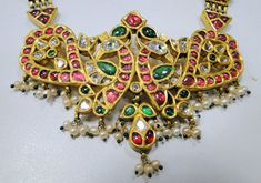 "20 carat solid gold, Old cut Diamonds ,Rubies and Emerald necklace (Kundan Meena choker). A large necklace Ideal for special occasions set with eye popping clear old cut genuine Diamonds Rubies and emaralds. A solid piece of jewelry good for family Heirloom which will last for ever.great workmanship and great value for Money. Length of necklace -30 cm (11.81\") free size easy to adjust according to your requierment by adding adjustable cord. Size of center pendant-8/5.5 cm, total weight -99.400 Festive Yellow Gold Kundan Pendant Necklace, Antique 22k Gold Chandbali Jewelry, Antique 22k Gold Meenakari Jewelry, Antique Kundan Jewelry In Yellow Gold, Hallmarked Traditional Kundan Necklace As Gift, Ceremonial Yellow Gold Kundan Chandbali Necklace, Traditional Hallmarked Kundan Necklace For Gifts, Antique Yellow Gold Jewelry With Meenakari, Yellow Gold Kundan Temple Necklace With Meenakari