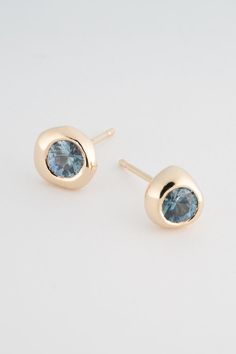 Our Blue Montana Sapphire Studs are an ode to the to the mismatched earring set. Organic and soft in form, each piece is hand carved into a free form shape that holds a bezel set 4mm Medium Blue Montana Sapphire. The earrings are meant to be worn as a pair or as singles in one ear. Stones: 4mm Medium Blue Montana Sapphires Casting + Earring Backings: 14k Yellow Gold Montana Sapphires, Sapphire Earrings Studs, Sapphire Studs, Montana Sapphire, Gemstone Studs, Sapphire Earrings, Bezel Setting, Medium Blue, Shop Necklaces