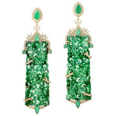 These stunning hand carved Jade earrings are thoughtfully and meticulously crafted in 18-karat gold. It is set in 25.24 carats Jade, 1.9 carats emerald and .90 carats of diamonds. FOLLOW MEGHNA JEWELS storefront to view the latest collection & exclusive pieces. Meghna Jewels is proudly rated as a Top Seller on 1stDibs with 5 star customer reviews. All items manufactured by us are handmade and can be customized or redesigned. Composition Size-67X19 Total Weight-16.481 Gold Weight(Gms)-10.745 Diam Luxury Hand Set Green Diamond Earrings, Unique Luxury Hand-tooled Jewelry, Luxury Bohemian Carved Jewelry, Luxury Dangle Emerald Jewelry, Luxury Emerald Dangle Jewelry, Luxury Carved Jewelry For Ceremonial Occasions, Luxury Carved Jewelry For Women, Luxury Carved Jewelry For Collectors, Luxury Ceremonial Carved Jewelry