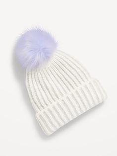 a white hat with a blue pom - pom