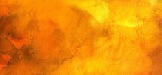 an orange and yellow painting with some black spots on it's surface, as well as the background