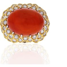 Capture the essence of timeless elegance with the David Webb Platinum & 18K Yellow Gold Oval Coral And Diamond 1970's Ring. This exquisite piece of jewelry carries with it a rich history, making it a cherished heirloom for those who appreciate the allure of vintage glamour.Crafted by the renowned jewelry designer David Webb during the 1970s, this ring showcases his signature style that captivated the world's elite. Webb's creations were a well-kept secret, adorning the fingers of the rich and fa Emerald Cut Diamond Ring, Rich And Famous, David Webb, Coral Ring, The David, Coral Jewelry, Oval Rings, Vintage Glamour, Emerald Cut Diamonds