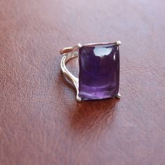 Gemstone - Amethyst Size - 13x18 rectangle Metal - sterling silver Natural purple amethyst ring available in all ring sizes Amethyst strengthens the aura of the wearer and creates your dominance among others The same design also available with many other gemstones please visit my shop to view the complete collection. feel free to contact me for any query regarding my jewelry Each order will be packed in the free handmade jewelry box Square Cut Amethyst Ring For Formal Occasions, Formal Square Cut Amethyst Ring, Rectangular Amethyst Ring For Gift, Modern Rectangular Rings With Accent Stones, Formal Birthstone Ring With Rectangular Stone, Modern Emerald Cut Amethyst Ring Gift, Modern Emerald-cut Amethyst Ring Gift, Purple Gemstone Ring With Rectangular Stone, Rectangular Silver Amethyst Gemstone Ring