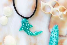 "Unique resin hippie necklace in the shape of a whale shark, made and handpainted by me. This ocean animal pendant is also available in light blue, dark blue, and black among others. The silver hooks are made of stainless steel so they are durable and resistant. Beautiful and natural pieces of jewelry to show your love for the ocean and marine life. These beautiful animals represent courage, strength and energy, so they are the ideal gift to surprise on a birthday. Each piece of sea life necklac Handmade Ocean Color Jewelry For Summer, Handmade Ocean Color Summer Jewelry, Unique Summer Jewelry For Gifting, Unique Blue Jewelry For Summer, Handmade Ocean Color Necklace For Gift, Cute Adjustable Hand Painted Jewelry, Cute Blue Necklaces For Summer, Resin Jewelry For Summer Gifts, Cute Adjustable Hand-painted Jewelry