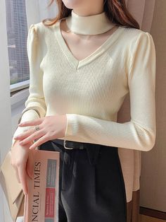 Features: This Hollow Out Halter Turtleneck sweater is the perfect addition to your winter wardrobe. Made with soft, warm fabric, it will keep you cozy on chilly days. The slim fit and solid color make it versatile for any occasion. Stay stylish and comfortable with this must-have knitwear piece.