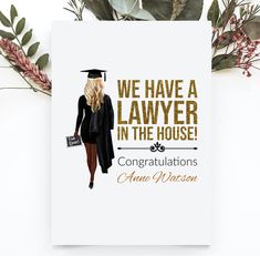 a card with the words we have a lawer in the house and an image of a woman wearing a graduation cap