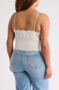 Showcase your sultry style in this flattering cropped camisole trimmed with lovely lace. 20" length (size 1X) V-neck Spaghetti straps 100% polyester Hand wash, line dry Imported Lace Crop Top Tank With Lace Trim, Lace Crop Top With Lace Trim, V-neck Lace Crop Top With Lace Trim, Chic Cropped Top With Delicate Lace, Cropped Lace Tank Top, Cropped Lace Tank Top With Lace Trim, Lace Crop Top Camisole, Lace Top Crop Camisole, Fitted Lace Tank Top With Crochet Trim