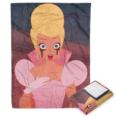 a towel with an image of a blonde woman on it and a wallet in front