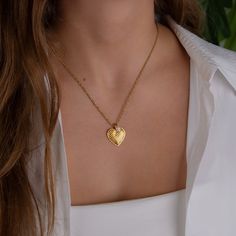 A delicate necklace in 18k gold plated stainless steel chain with a heart pendant. A unique handmade necklace with a small pearl. Layer it perfectly with other necklaces from our shop ❤ Handmade in Greece ❤ ❤ - Details - * 18k gold plated stainless steel chain * length 40cm plus 5cm extension chain * Heart charm in 18k gold plated zamak - 23mm * freshwater pearl * Nickel free * This listing is for one heart necklace! For more similar items visit my shop www.etsy.com/your/shops/AgapimenoHandmade Valentine's Day Yellow Gold Heart Charm Necklace, Valentine's Day Gold-tone Charm Necklaces Gift, Heart-shaped Gold-tone Charm Necklace For Gift, Elegant Gold-tone Charm Necklaces For Valentine's Day, Valentine's Day Gold-tone Charm Necklace, Gold Heart Necklace, Vintage Heart, Best Wear, Lovely Jewellery