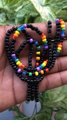 Stretchy Anklet made with Black glass seed beads (6/0) and green, Yellow, orange , blue, purple, red glass seed beads (6/0) Rainbow Anklet, Earth Bracelet, Pop Beads, Bracelets Stack, Metal Bead Bracelet, Wave To Earth, Gifts For Friend, Bracelets Design, Belly Jewelry